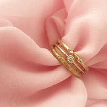 Load image into Gallery viewer, Diamond bezel ring with two gold bands