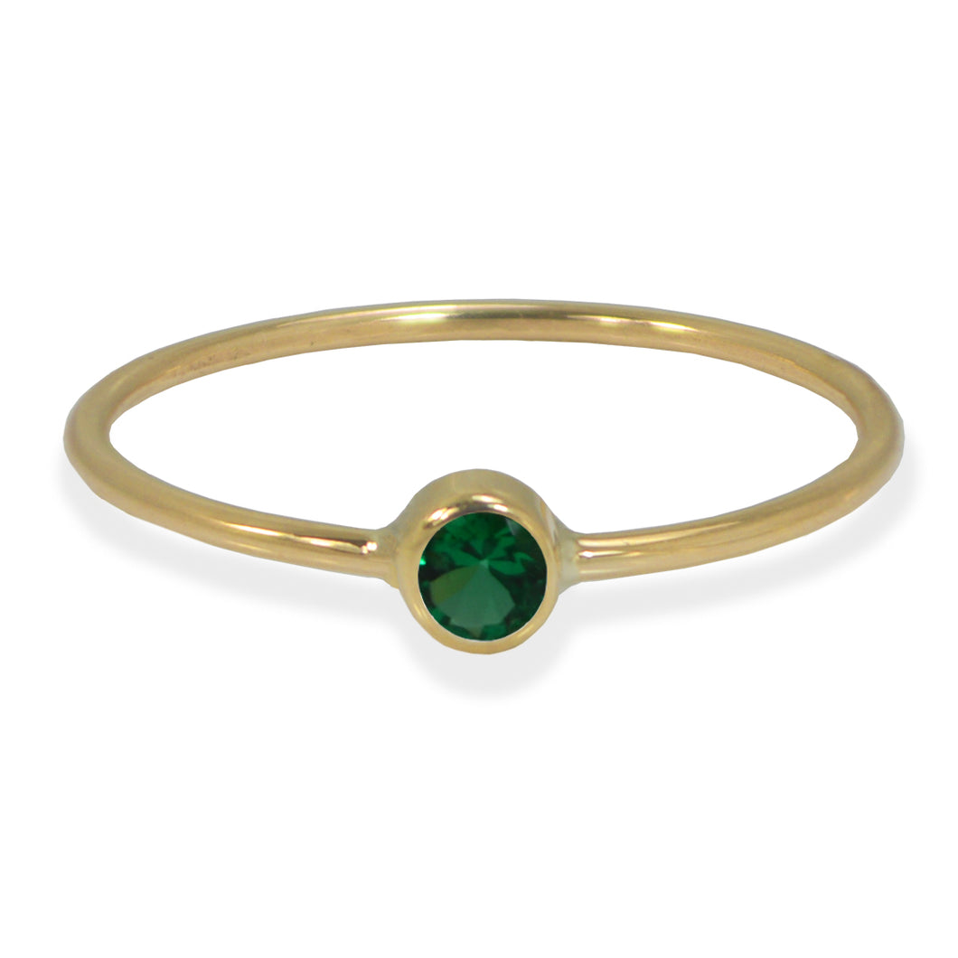 Emerald bezel ring in yellow gold